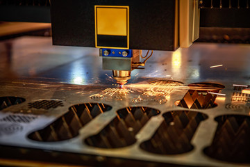 CNC Laser cutting of metal, modern industrial technology. .