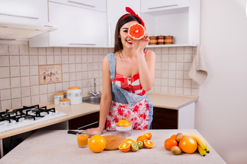 cooking in the kitchen beautiful girl, sexy brunette, vegetarian food