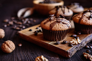 Coffee muffins with grated walnut and topped with chocolate