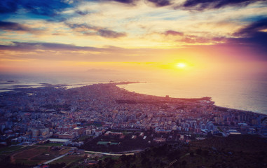 Sunset over the city from on high.