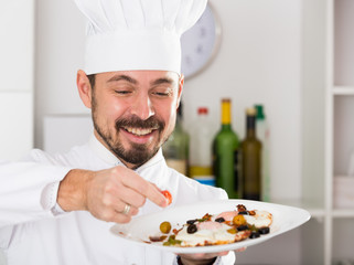 Male cook preparing food