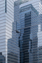 Fototapeta na wymiar Skyscrapers reflective glassy walls and reflections of another buildings on them in Seoul, South Korea.