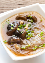 Bowl of shiitake soup on the wooden table