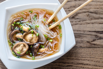 Bowl of shiitake soup on the wooden table