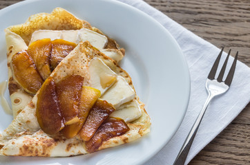 Crepes with brie and caramelized slices of apple