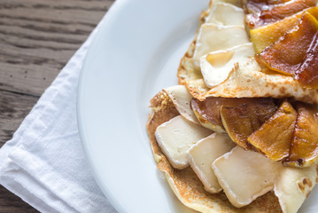 Crepes with brie and caramelized slices of apple