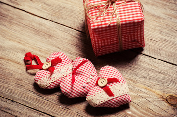 Heart on a wooden background and gift box