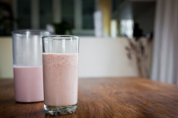 Smoothie and biscuits on a wooden table