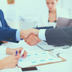 Business people shaking hands, finishing up a meeting