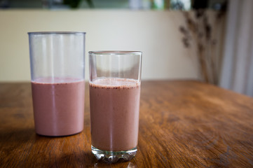 Smoothie and biscuits on a wooden table
