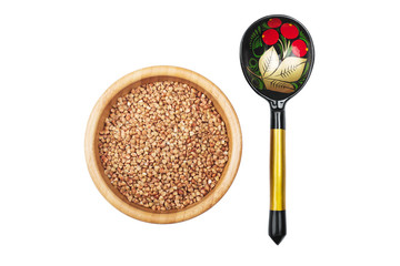 Buckwheat in bowl and russian hand pained spoon isolated on whit