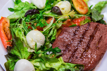 Beef steak with green salad