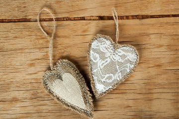 Heart made of cloth on wood desk.