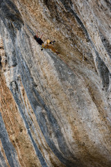 Outdoor activity. Extreme rock climbing lifestyle. Male rock climber on a cliff wall. Siurana, Spain. 