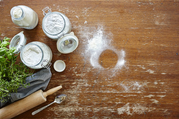 atmospheric baking scene flour on wooden table