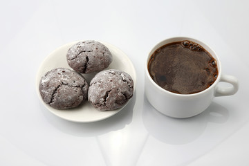 white Cup of black coffee with biscuits on white background.