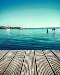 Fototapeten Pier Couple dreaming on water jetty by lake  © diamant24