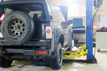 Naklejka na ściany i meble Cars in car repair station