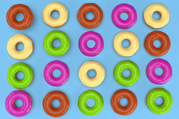 Colorful donuts on blue background. 3d rendering