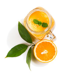 Healthy orange smoothie, top view.