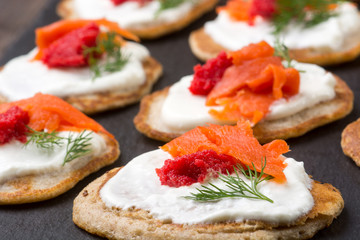 Russian buckwheat pancakes blini with cream and caviar