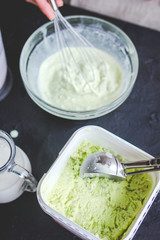 organic ice cream homemade process on dark background with hands