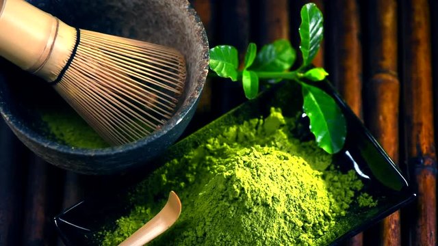 Organic green matcha tea powder. Top view. Dolly shot. Full HD 1080p video footage