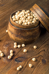 Obraz na płótnie Canvas Portion of Chick Peas in wooden bowl