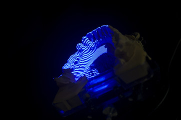 Dental technician scanning a dental cast model in a 3D surface s