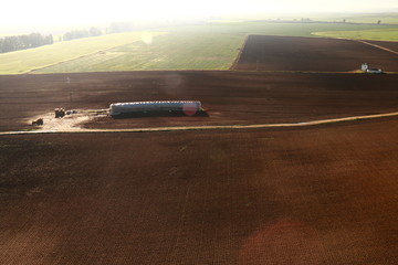 Obraz na płótnie Canvas Aerial view of fields and farmland taken from a hot air balloon
