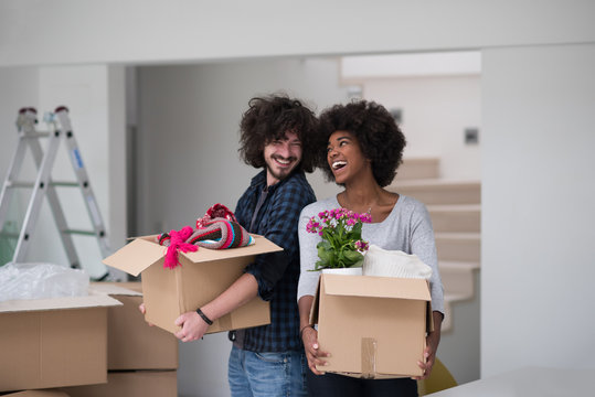 multiethnic couple moving into a new home