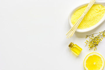 Cosmetic oil and sea sail for bath white background top view