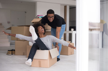 African American couple  playing with packing material