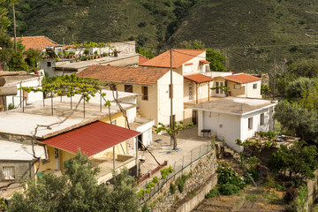 Fototapeta na wymiar Traditional houses with red roofs in mountains on Crete Island. Greece.