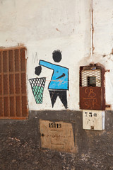 Symbol throwing trash, painted on the wall, Morocco