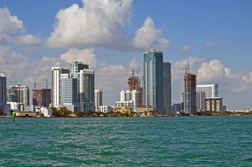 Fototapeta na wymiar Miami skyline with luxury condominiums and luxury condominiums under construction overlooking biscayne bay.