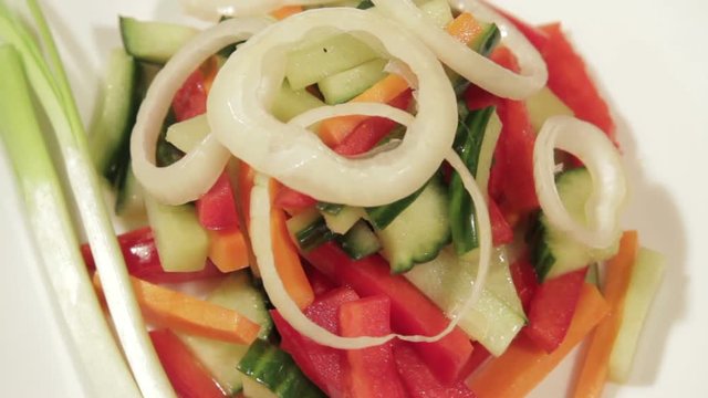 Healthy salad with fresh vegetables. Dietetic foods from environmentally friendly organic products. Vegetables from his garden. Slow rotate (1080p 25 fps; canon 7d, Sigma 24-70)