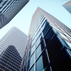 Skyscrapers with blue glass, high rise building, skyscrapers, business concept of successful industrial architecture. 3d rendering