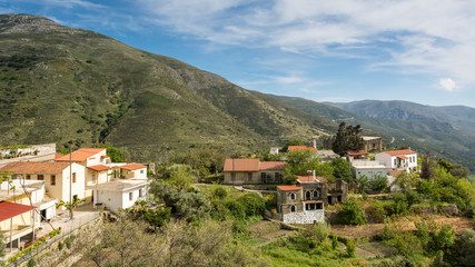 Fototapeta na wymiar Houses in valley between the hills on Crete Island. Greece.