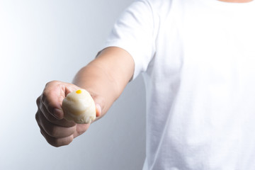 Hand holding Chinese pastry moon cake