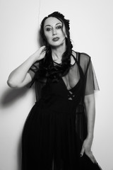 Fototapeta premium Elegant fashionable woman wearing black dress