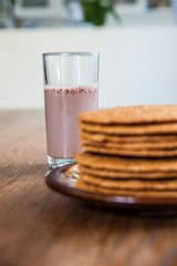 Smoothie and biscuits on a wooden table