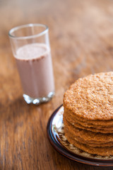 Smoothie and biscuits on a wooden table