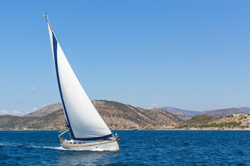 Fototapeta na wymiar Sailboat in the sailing regatta. Luxury yachts.