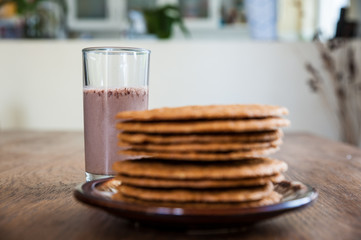 Smoothie and biscuits on a wooden table