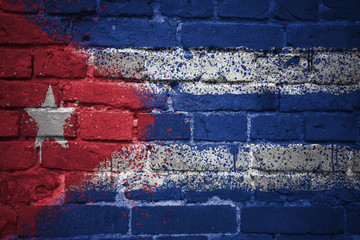 painted national flag of cuba on a brick wall