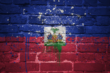 painted national flag of haiti on a brick wall