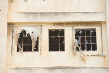 Fototapeta na wymiar Close up Abandoned vandalised factory windows