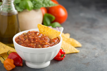 Homemade spicy tomato salsa with vegetables and olive oil - obrazy, fototapety, plakaty