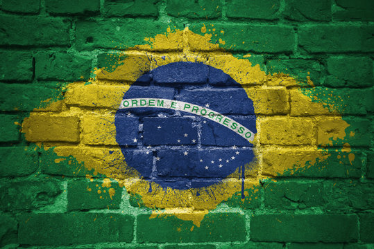 painted national flag of brazil on a brick wall